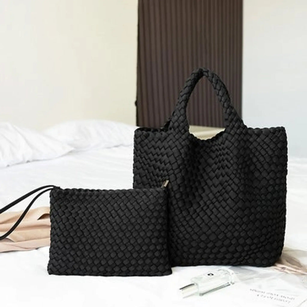 Woven neoprene tote and removable zipper pouch with black braided design.