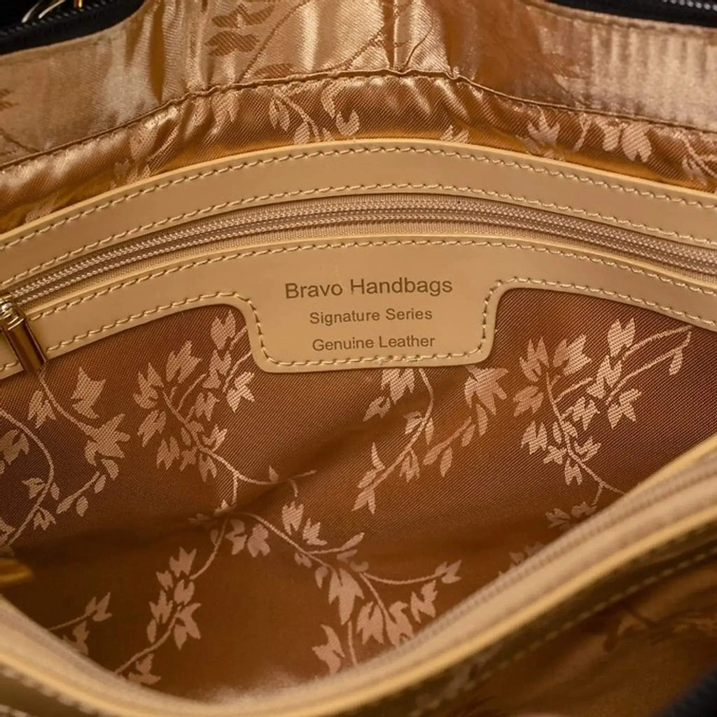 Elegant interior view of the Bravo Fashion Large Galina Tweed Print Leather Bag, showcasing the luxurious gold leaf cotton-polyester twill lining and secure zipper pocket.