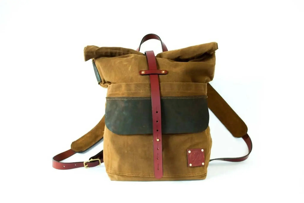 Harland Rolltop Pack in nutmeg waxed canvas with chestnut leather straps.