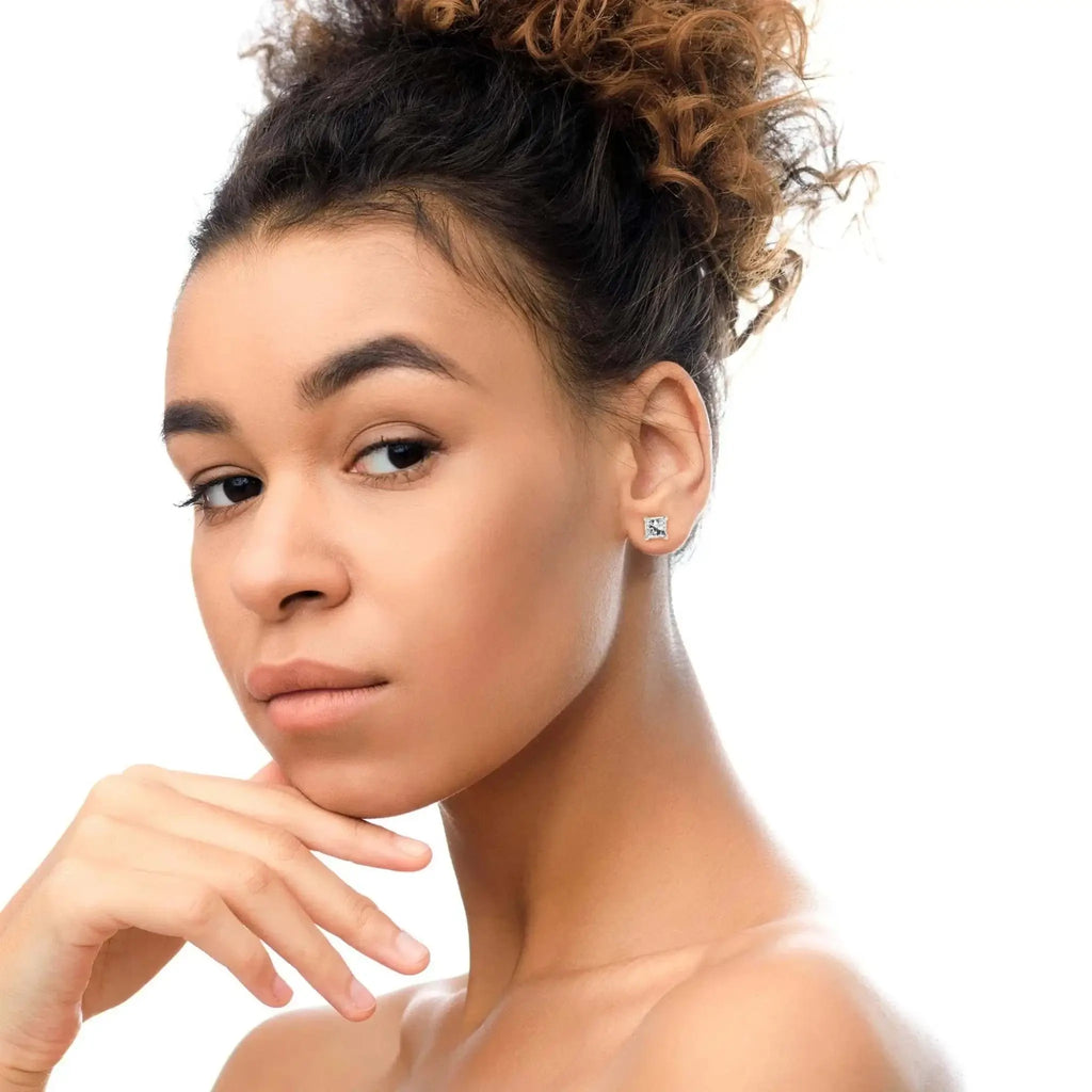 14K white gold princess-cut diamond stud earrings on model.
