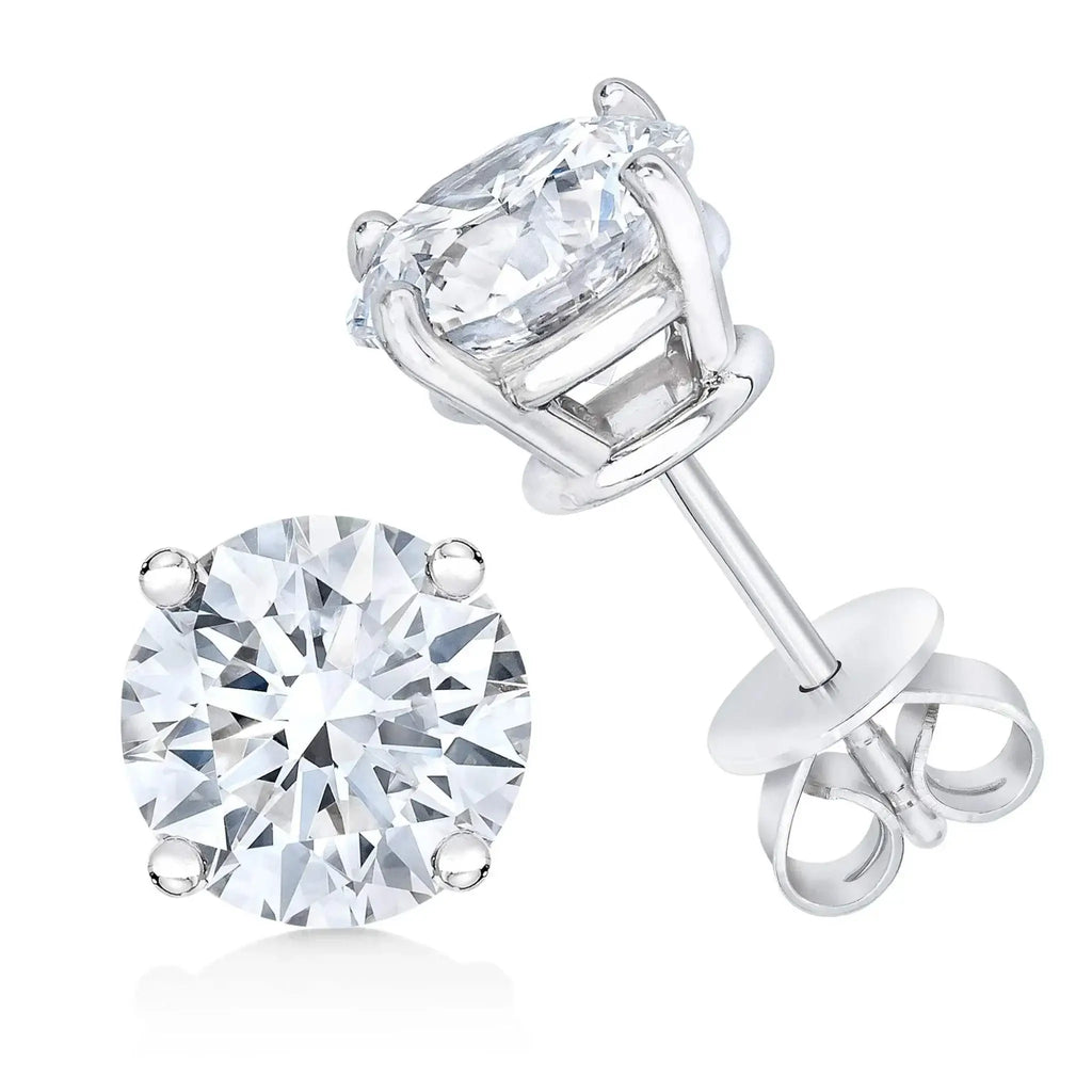 14K white gold diamond solitaire stud earrings with 1/2 CTW round-cut stones and 4-prong setting.