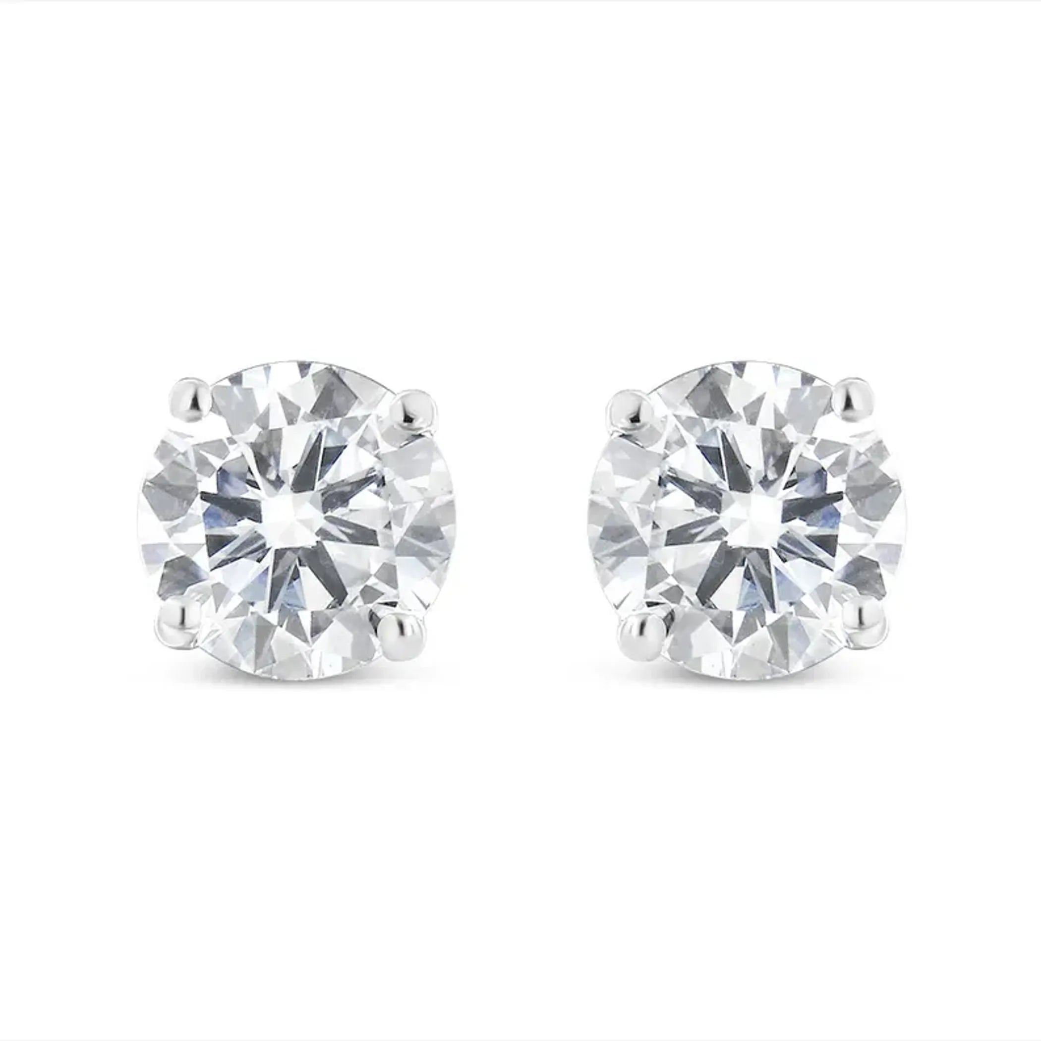 10K white gold diamond stud earrings with round brilliant-cut stones in four-prong settings.