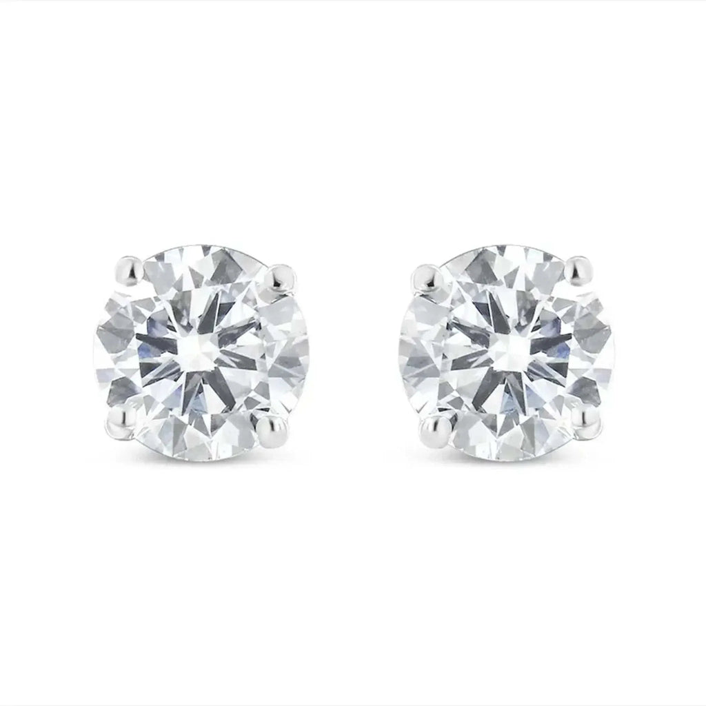 10K white gold stud earrings with 1.00 Cttw round brilliant-cut near colorless diamonds in 4-prong settings.