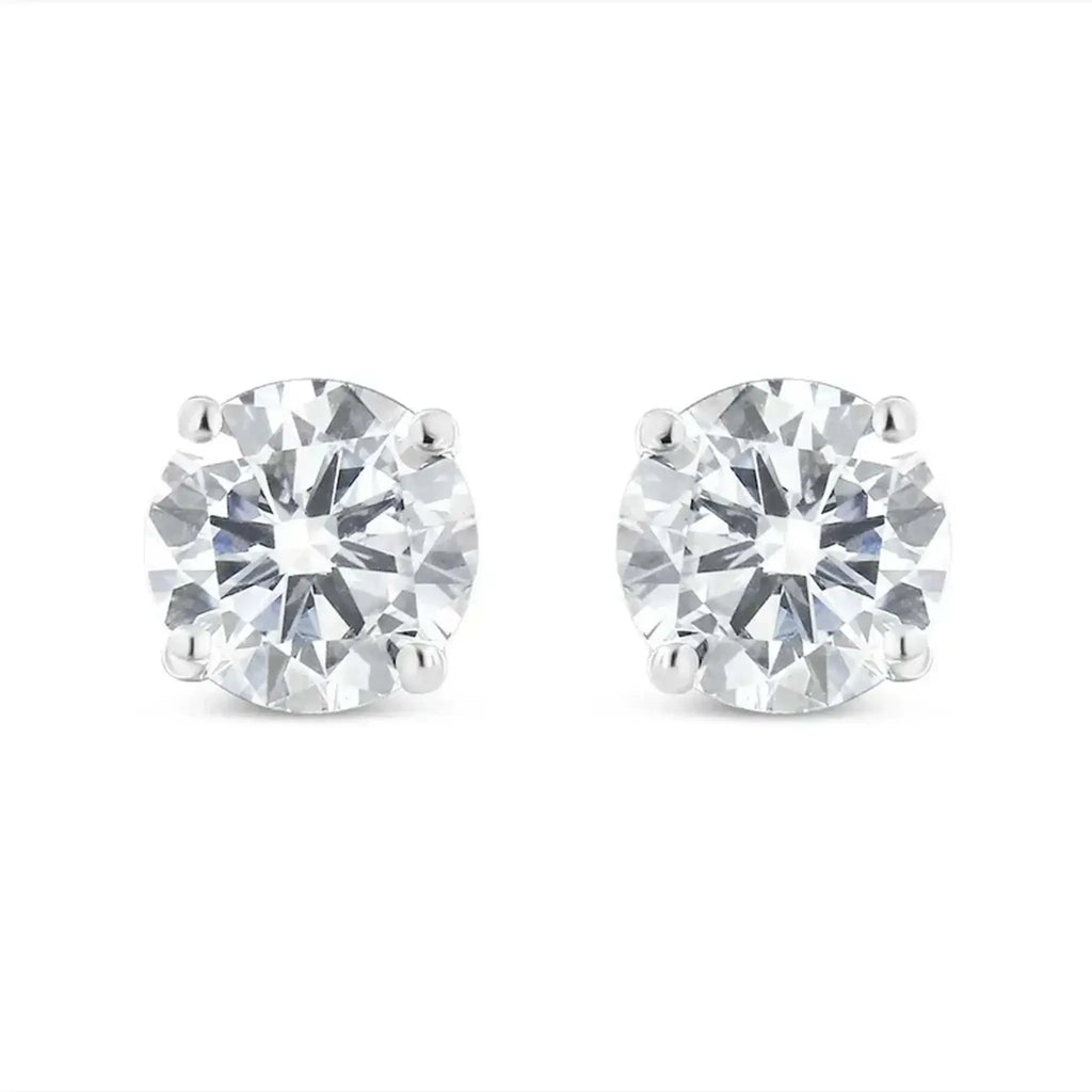 10K white gold diamond stud earrings with round brilliant-cut near-colorless diamonds in 4-prong settings.
