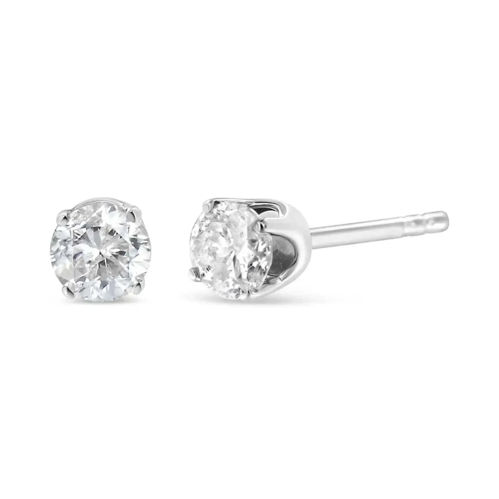 14K white gold diamond stud earrings with near colorless round brilliant-cut stones in 4-prong setting.