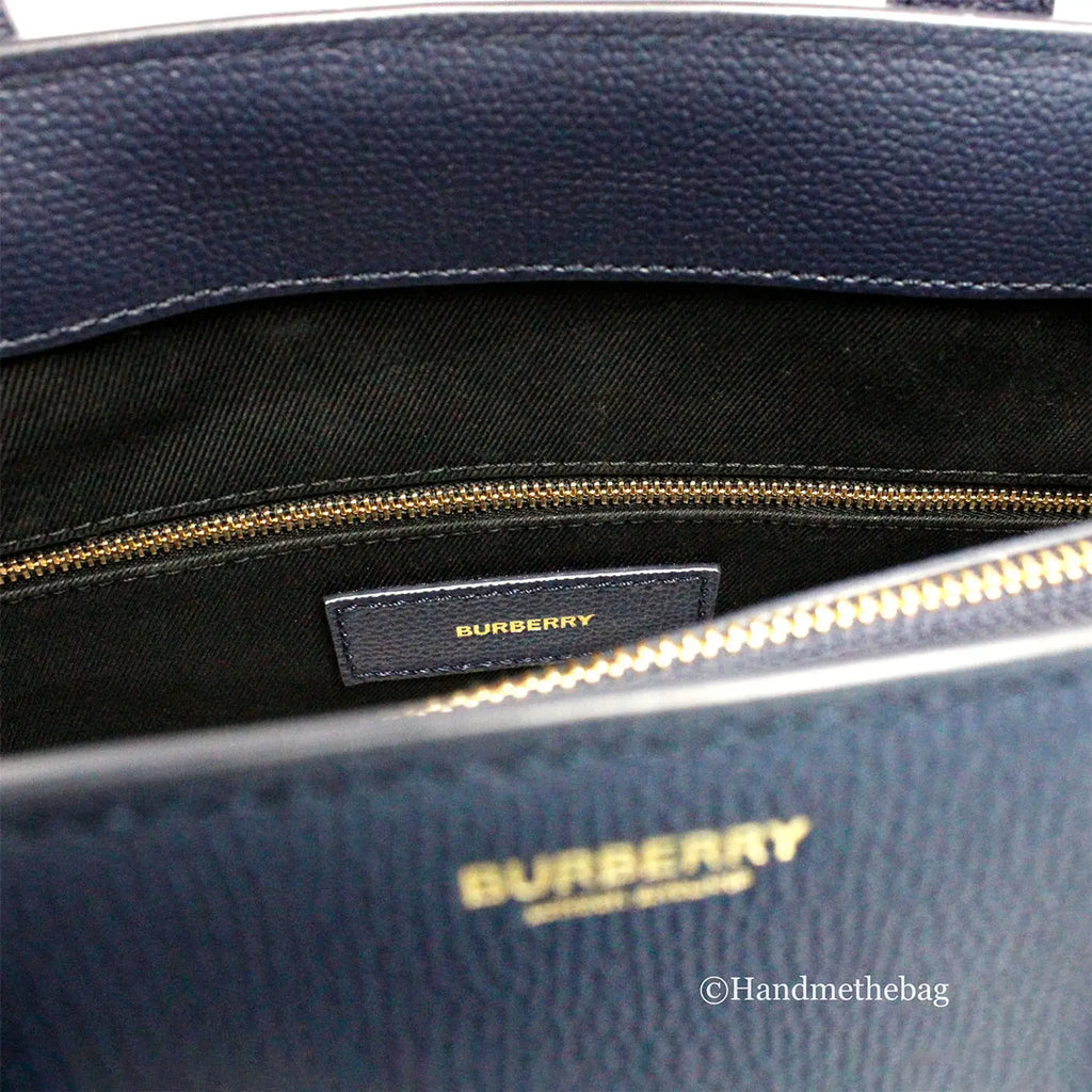 Burberry Banner Medium Regency Blue Leather Tote Bag with adjustable crossbody strap and inner zip pockets.