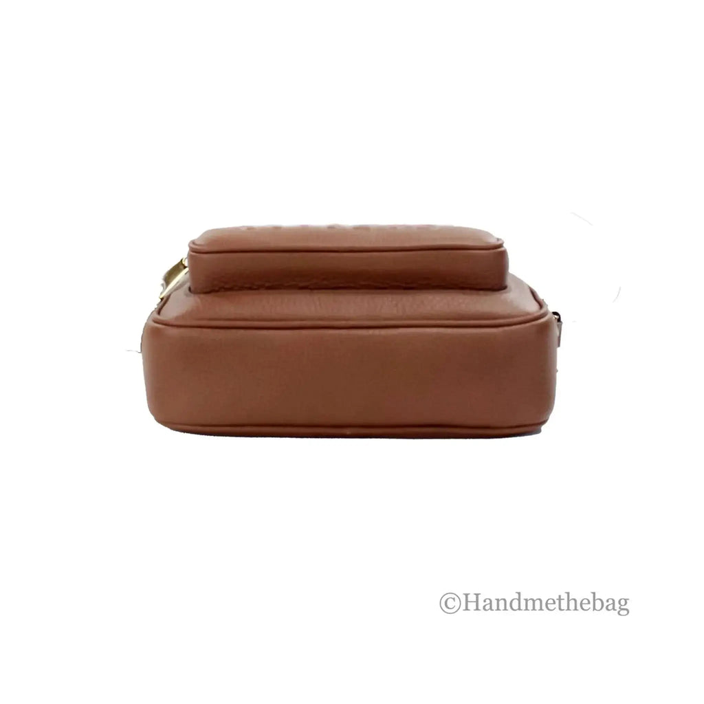 Burberry small tan leather camera crossbody bag with adjustable strap and nylon lining.