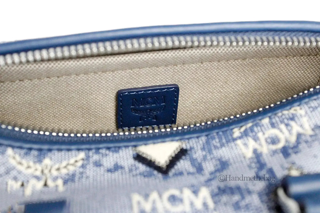 Close-up of MCM Boston Mini Blue Vintage Jacquard Satchel showing interior label and logo design.