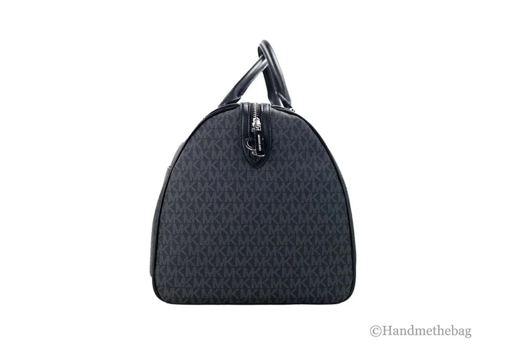 Michael Kors extra large black duffel travel bag with signature PVC and adjustable strap.