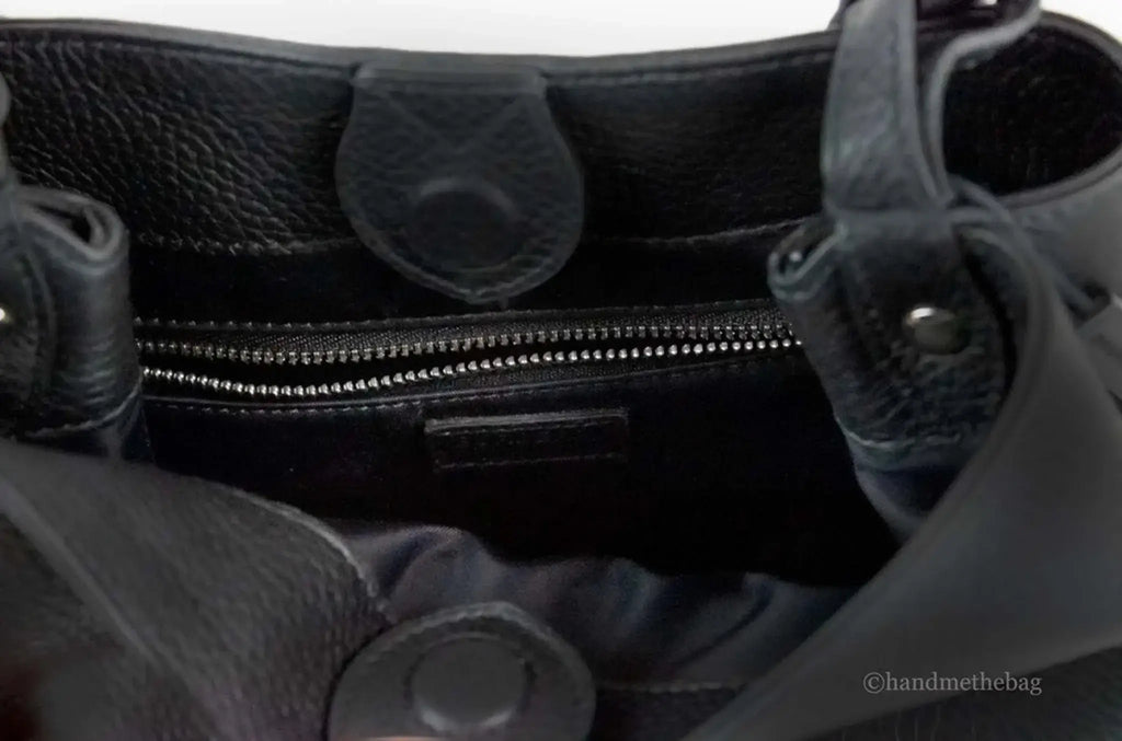 Burberry Lorne small black leather bucket crossbody bag with soft nylon lining and inner zip pocket.