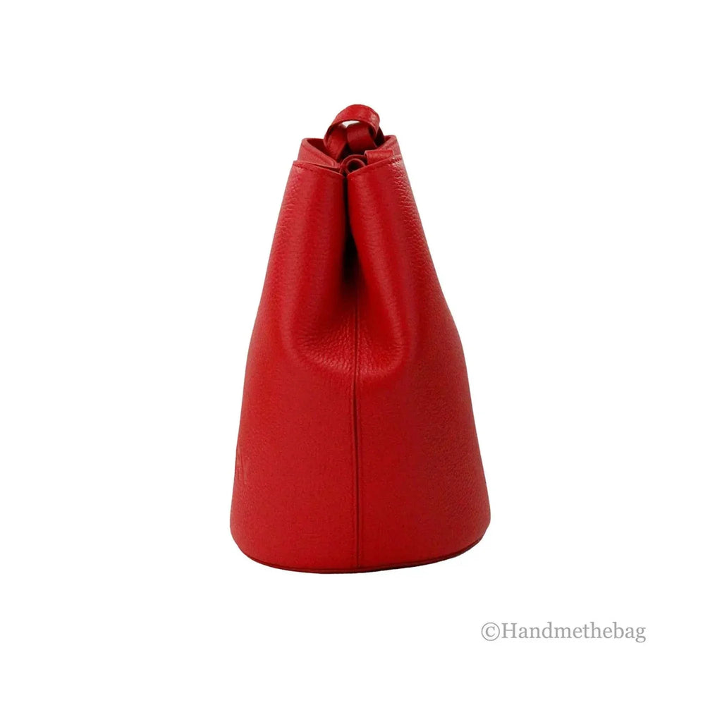 Burberry Lorne small red leather crossbody bucket bag with adjustable strap.