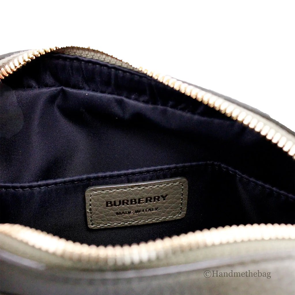Burberry fern green leather crossbody bag with branded interior label, adjustable strap, and zip pocket.