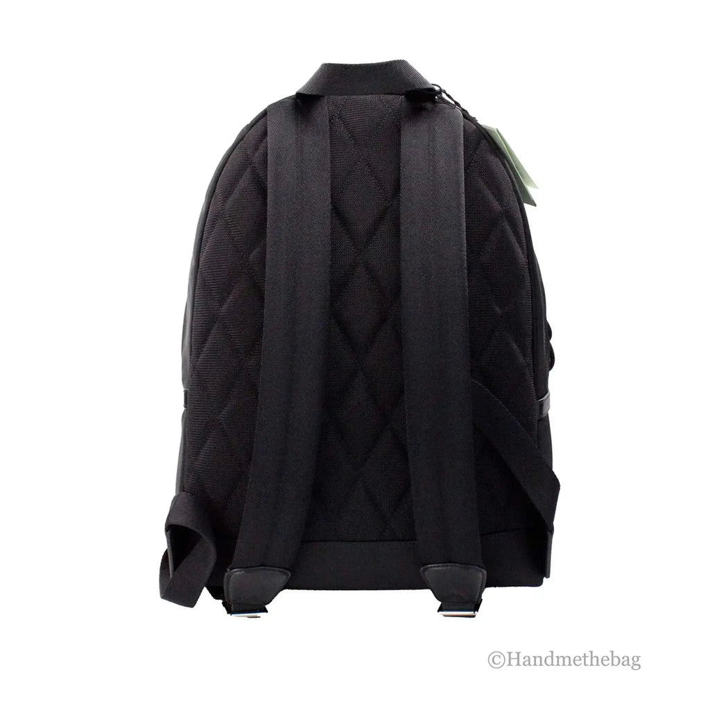 Burberry Abbeydale black nylon backpack with adjustable straps and quilted back design.