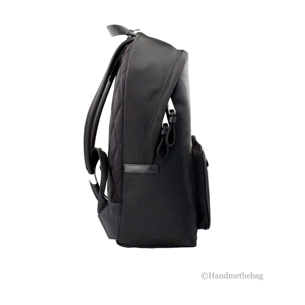 Burberry Abbeydale black nylon backpack with adjustable straps and multiple pockets.