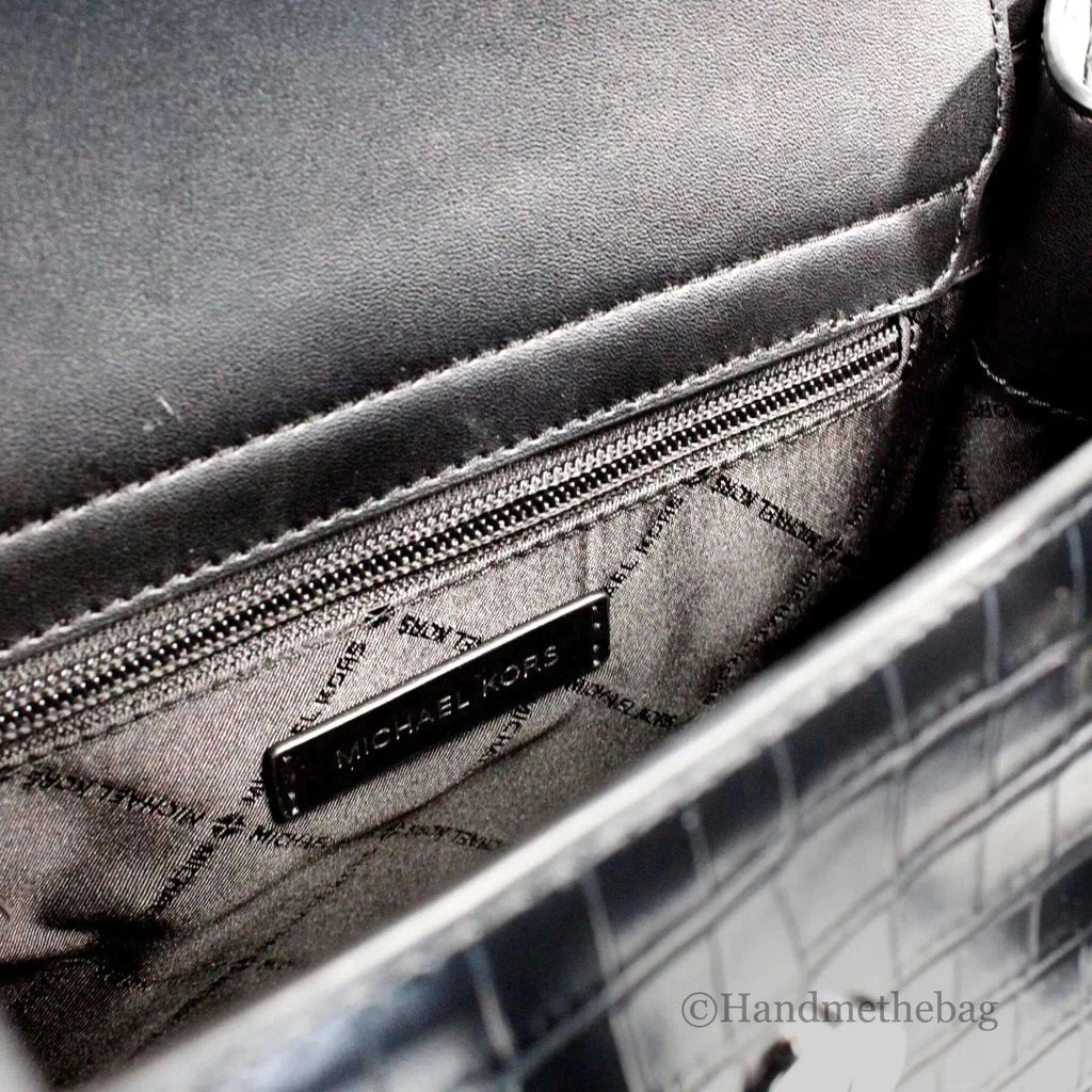 Michael Kors Carmen medium black embossed leather satchel interior with zip pocket and embossed logo.