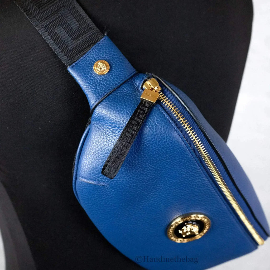 Versace small navy blue leather fanny pack with Medusa pendant, zip closure, and grainy texture.