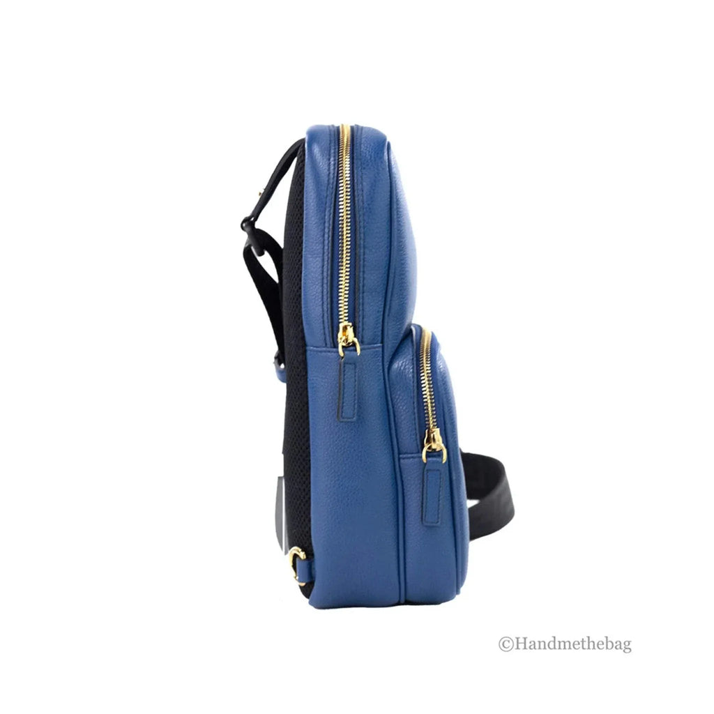Navy blue Versace Medusa small leather sling pack backpack with gold zippers.