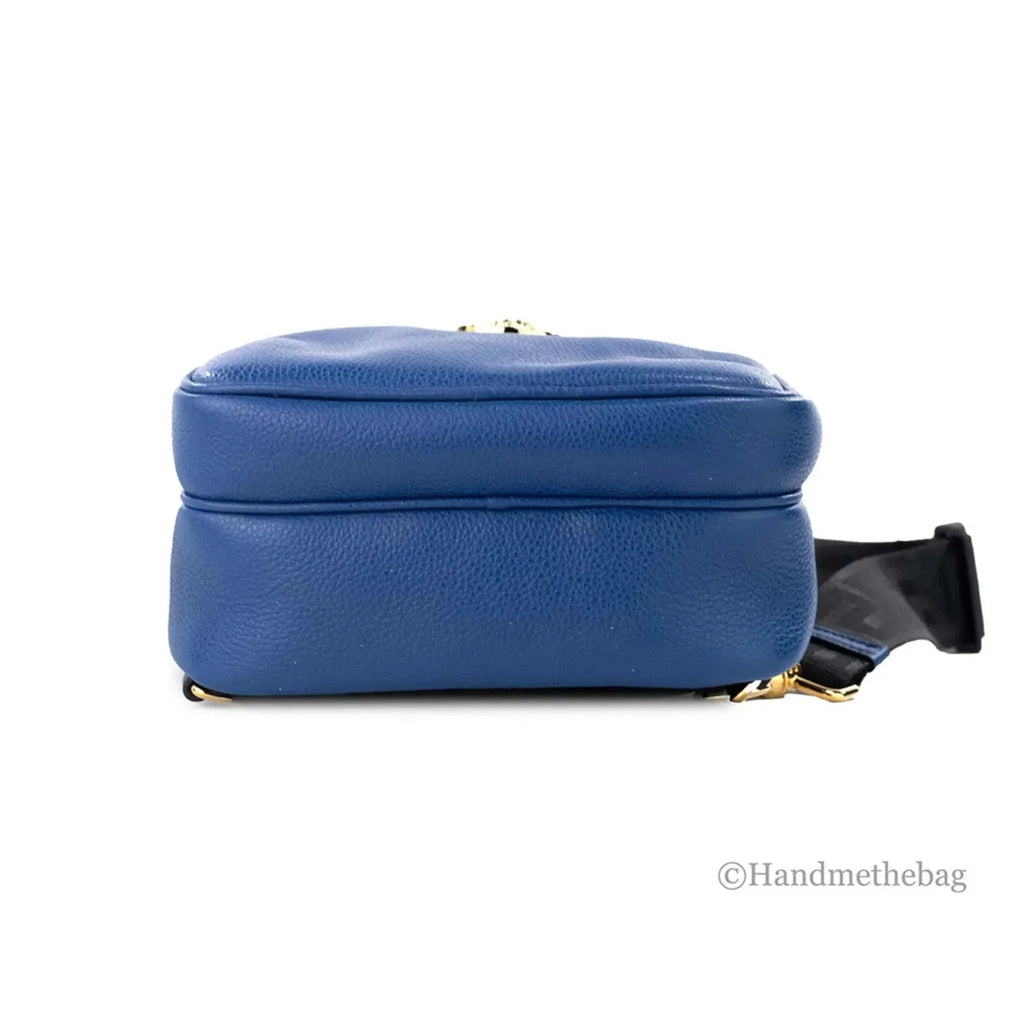 Versace Medusa navy blue small leather sling pack backpack with gold accents viewed from the side.