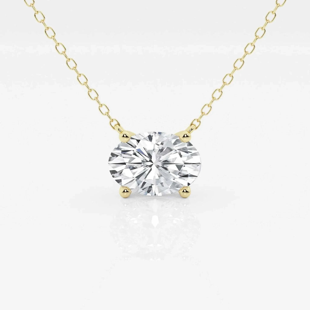 Oval lab-grown diamond solitaire pendant on 18-inch yellow gold chain.